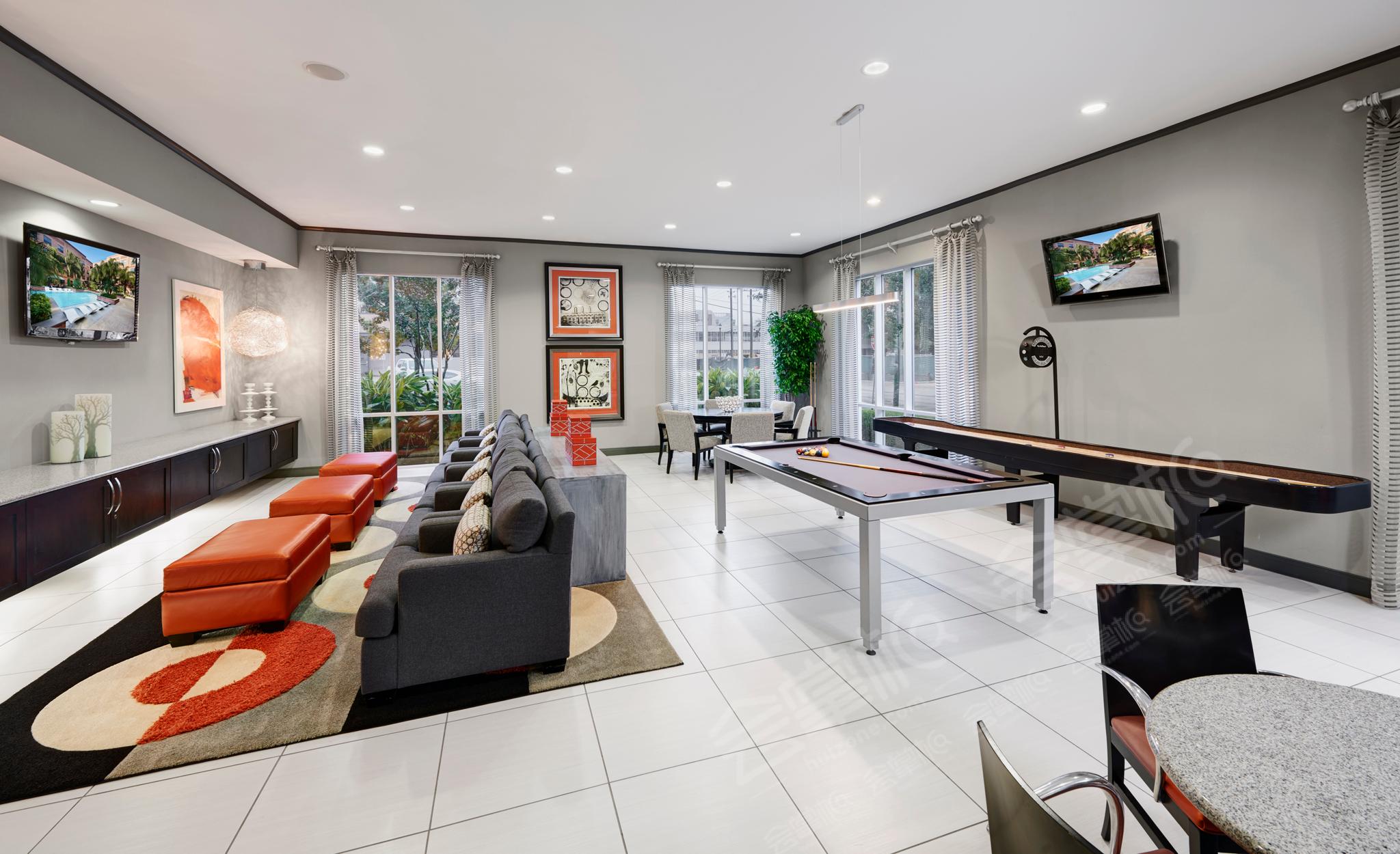 Spacious Event Space with Lounge Seating, Gourmet Kitchen, and Games for Entertaining - Travis Street