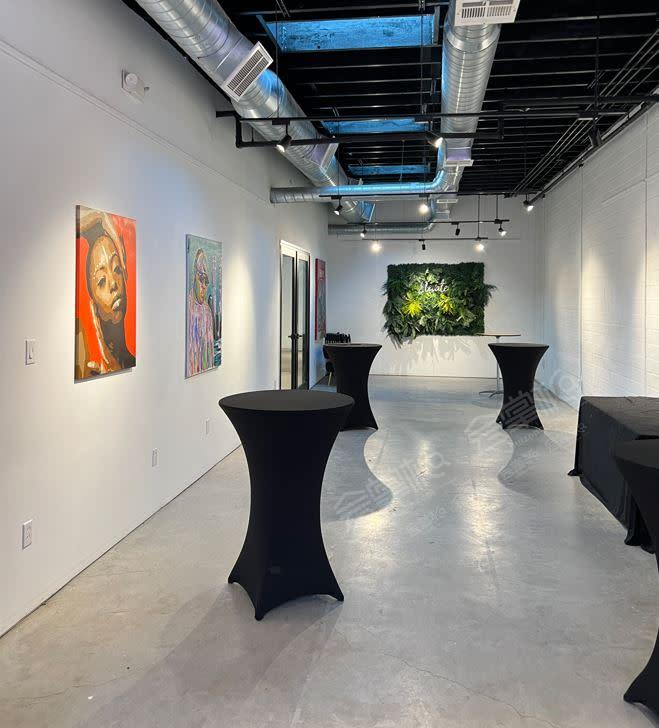 Sleek and intimate art gallery with luxe aesthetic