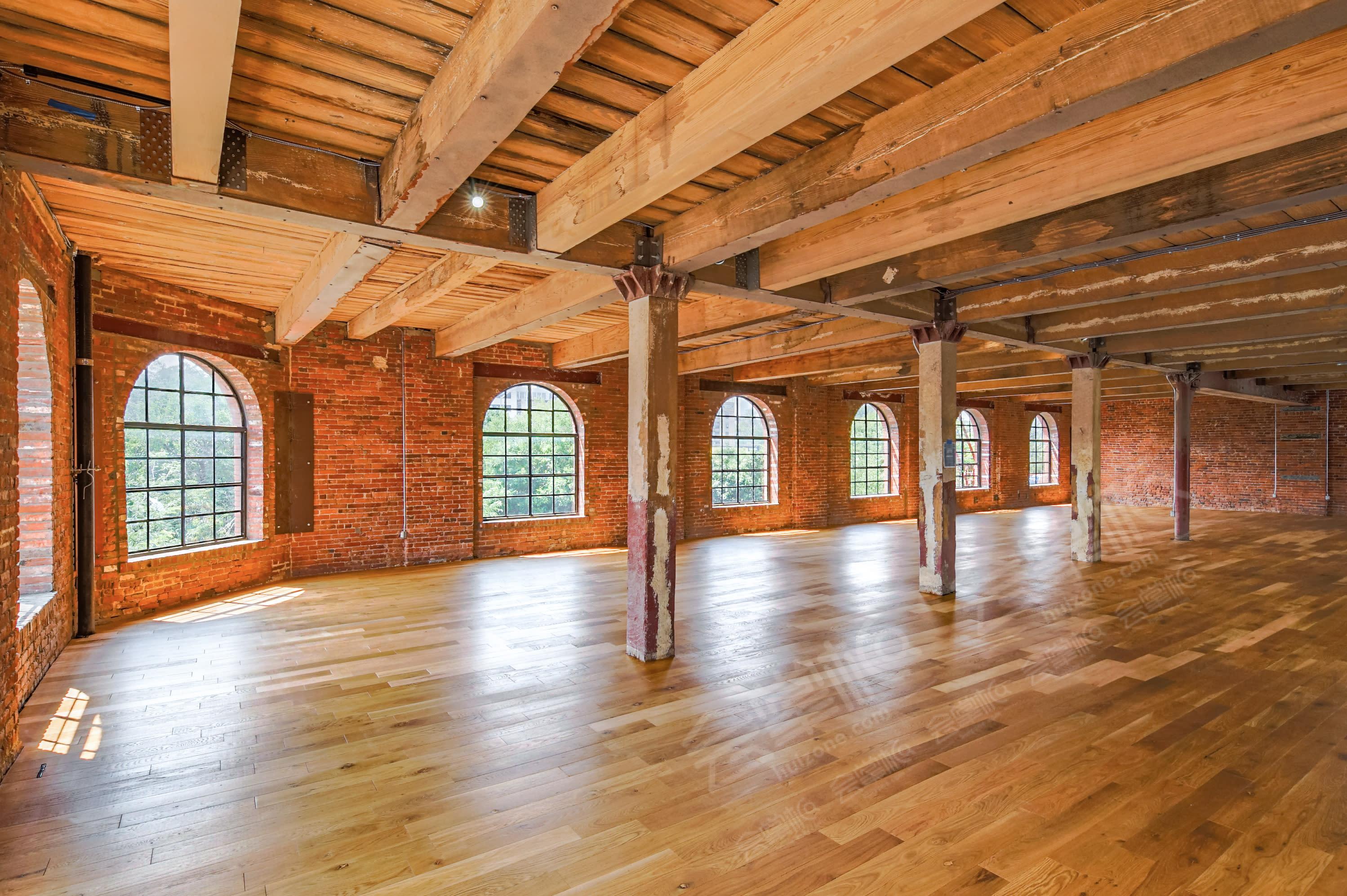 Historic Brick Studio featuring Beautiful Arched Windows and High Ceilings